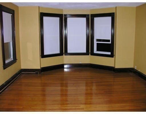 spare room with dark wood-type flooring