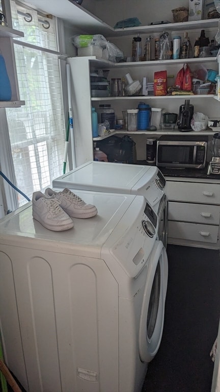 laundry room with independent washer and dryer