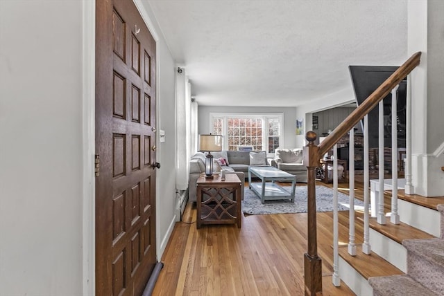 entrance foyer featuring hardwood / wood-style floors