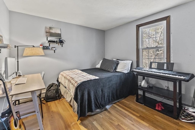 bedroom with wood-type flooring