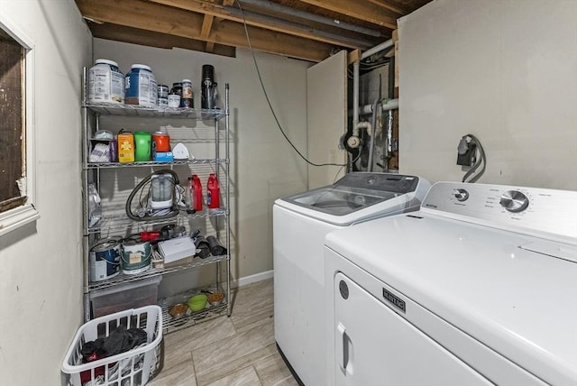 washroom featuring washer and clothes dryer