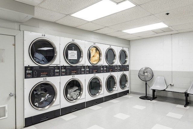 laundry area with stacked washer / dryer and washing machine and dryer