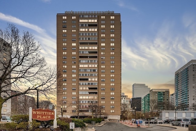 view of outdoor building at dusk