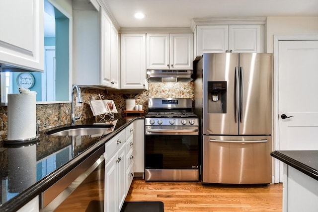 28 Foster Dr, Framingham, MA 01701 - kitchen featuring appliances with stainless steel finishes, under cabinet range hood, a sink, white cabinets, and recessed lighting