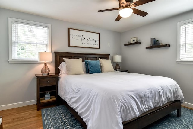 28 Foster Dr, Framingham, MA 01701 - bedroom with baseboards, wood finished floors, and ceiling fan