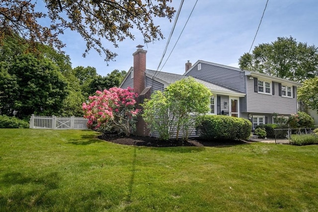 28 Foster Dr, Framingham, MA 01701 - view of home's exterior with a chimney