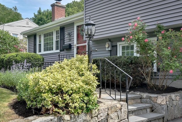 28 Foster Dr, Framingham, MA 01701 - doorway to property with a chimney