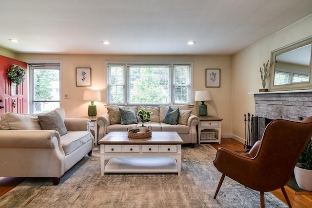 28 Foster Dr, Framingham, MA 01701 - living room with wood finished floors, a brick fireplace, recessed lighting, and baseboards