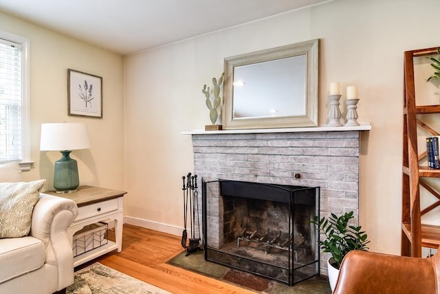 28 Foster Dr, Framingham, MA 01701 - living area with wood finished floors, a fireplace, and baseboards