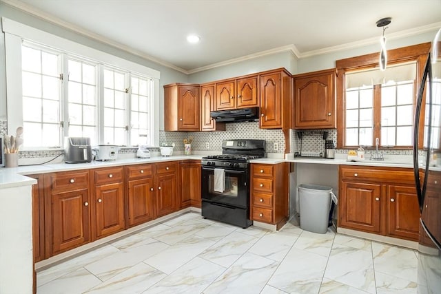 350 Wentworth Ave, Lowell, MA 01852 - kitchen featuring black range with gas cooktop, under cabinet range hood, a sink, brown cabinetry, and light countertops
