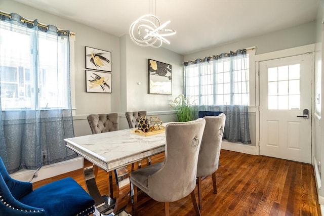 350 Wentworth Ave, Lowell, MA 01852 - dining space featuring a chandelier, healthy amount of natural light, and wood finished floors