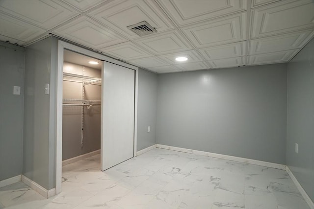 350 Wentworth Ave, Lowell, MA 01852 - unfurnished bedroom with light marble finish flooring, baseboards, a walk in closet, and recessed lighting
