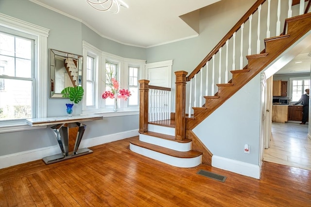 350 Wentworth Ave, Lowell, MA 01852 - stairs with baseboards, hardwood / wood-style floors, and ornamental molding