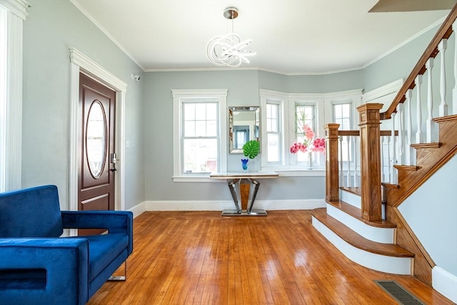 350 Wentworth Ave, Lowell, MA 01852 - foyer with wood-type flooring, baseboards, stairway, healthy amount of natural light, and ornamental molding