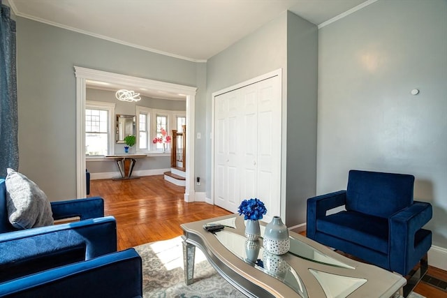 350 Wentworth Ave, Lowell, MA 01852 - living room featuring wood finished floors, ornamental molding, baseboards, and a chandelier
