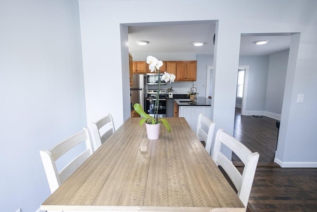 14 Fales St, Worcester, MA 01606 - dining area with baseboards and dark wood-style flooring