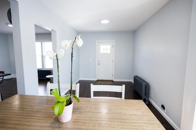 14 Fales St, Worcester, MA 01606 - dining room featuring radiator heating unit, baseboards, and dark wood finished floors