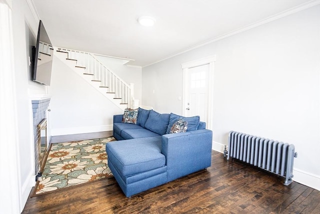 14 Fales St, Worcester, MA 01606 - living area with radiator, stairway, wood finished floors, and ornamental molding