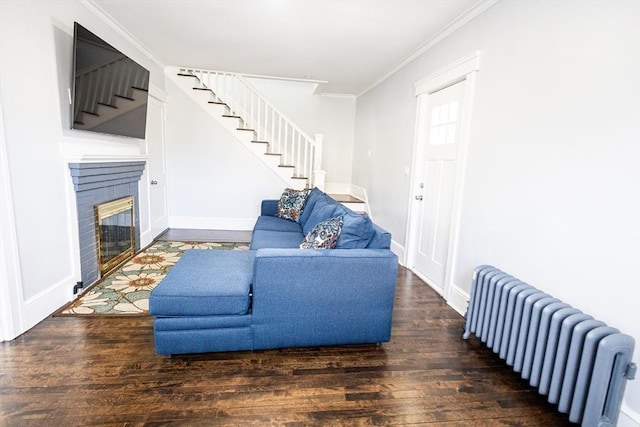 14 Fales St, Worcester, MA 01606 - living area featuring radiator, stairway, wood finished floors, ornamental molding, and baseboards