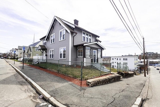 14 Fales St, Worcester, MA 01606 - view of home's exterior featuring a chimney and a residential view