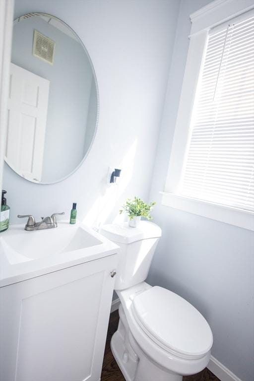 14 Fales St, Worcester, MA 01606 - half bathroom with visible vents, vanity, and toilet