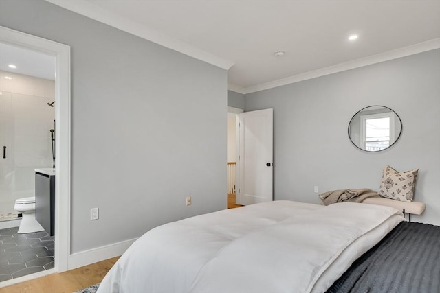 bedroom featuring ornamental molding, recessed lighting, ensuite bath, and light wood-style floors