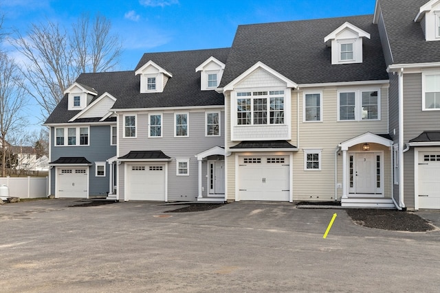 multi unit property featuring a garage