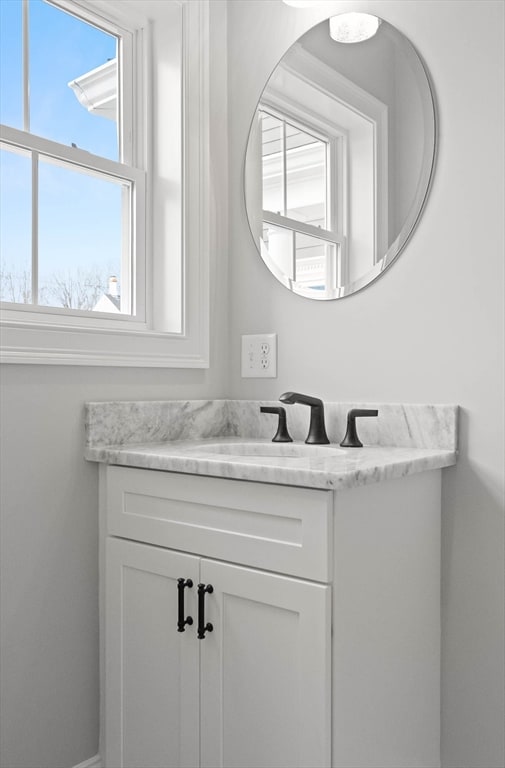 bathroom featuring vanity and a wealth of natural light