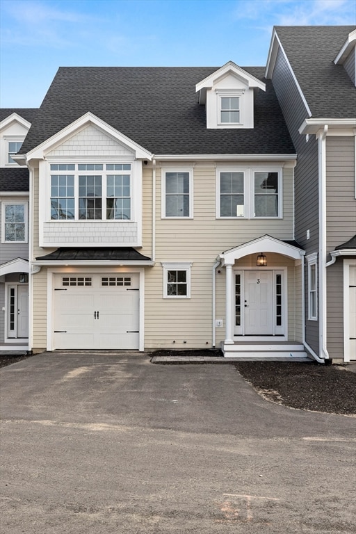 multi unit property featuring a garage