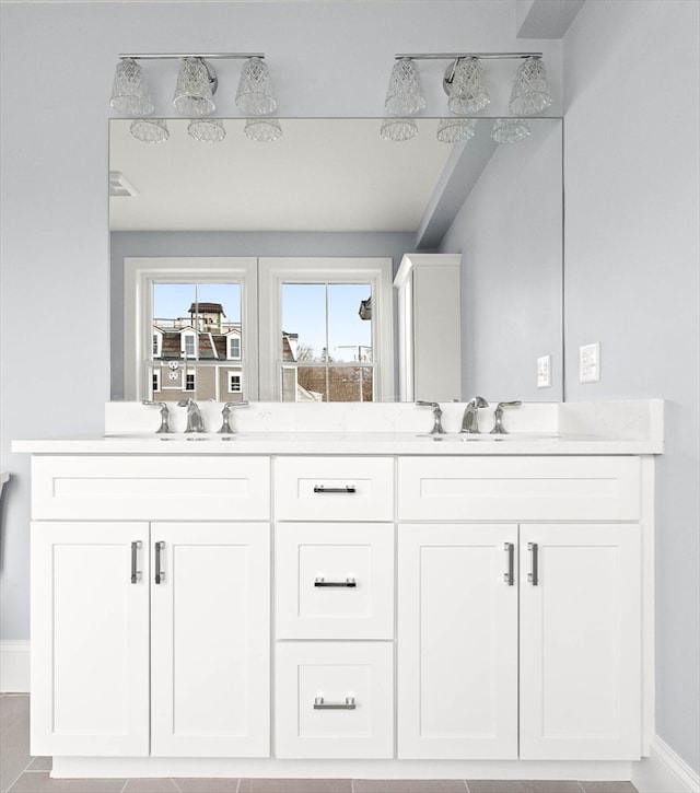 bathroom with vanity and tile patterned floors