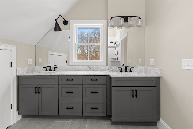 bathroom with vanity and vaulted ceiling