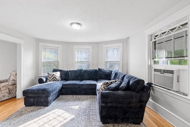 190 Winthrop St, Taunton, MA 02780 - living area featuring plenty of natural light, wood finished floors, and cooling unit