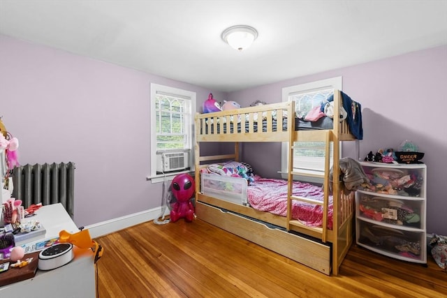 190 Winthrop St, Taunton, MA 02780 - bedroom with wood finished floors, radiator heating unit, and cooling unit