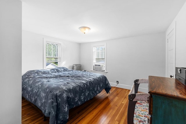 190 Winthrop St, Taunton, MA 02780 - bedroom featuring radiator heating unit, wood finished floors, and cooling unit