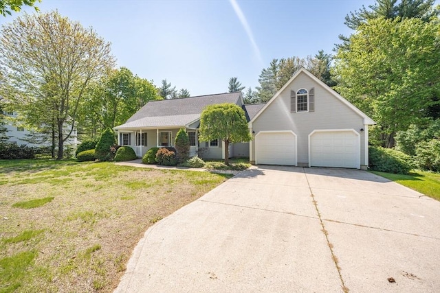 9 Lauren Ln, Southwick, MA 01077 - view of front of property featuring a garage, driveway, and a front lawn