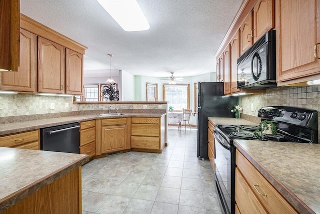 9 Lauren Ln, Southwick, MA 01077 - kitchen featuring black appliances, a sink, a peninsula, backsplash, and a textured ceiling