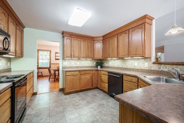 9 Lauren Ln, Southwick, MA 01077 - kitchen with black appliances, a sink, backsplash, and pendant lighting