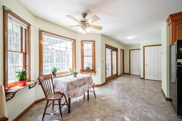 9 Lauren Ln, Southwick, MA 01077 - dining space featuring baseboards, a ceiling fan, and a textured ceiling