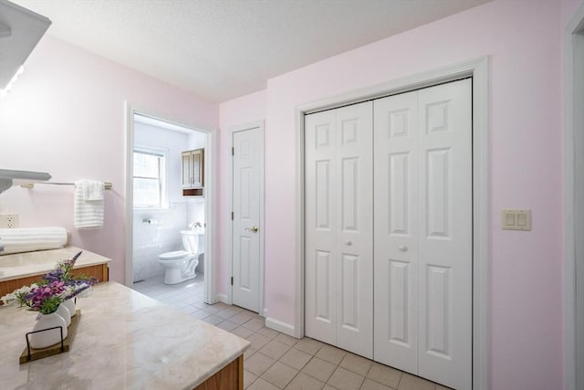9 Lauren Ln, Southwick, MA 01077 - full bath featuring tile patterned flooring, toilet, a closet, and baseboards