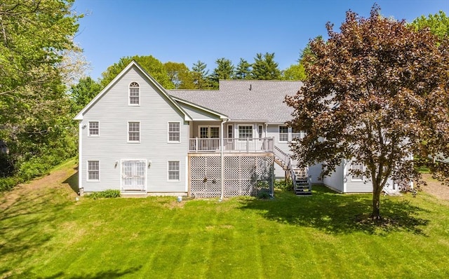9 Lauren Ln, Southwick, MA 01077 - rear view of property with a lawn, stairway, a wooden deck, and roof with shingles