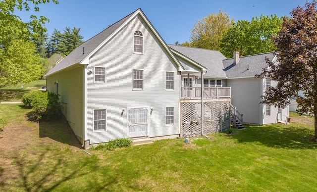 9 Lauren Ln, Southwick, MA 01077 - rear view of property featuring a yard, a wooden deck, and a shingled roof