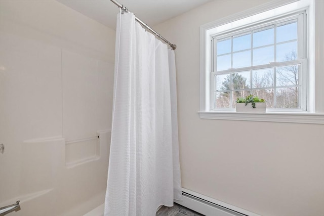 full bath with a baseboard radiator and curtained shower