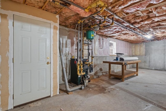 unfinished basement featuring a heating unit