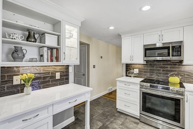 35 Wallace Rd, Wayland, MA 01778 - kitchen with visible vents, decorative backsplash, white cabinetry, and appliances with stainless steel finishes