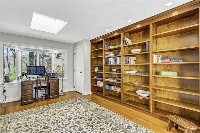 35 Wallace Rd, Wayland, MA 01778 - home office featuring baseboards, recessed lighting, wood finished floors, and a skylight
