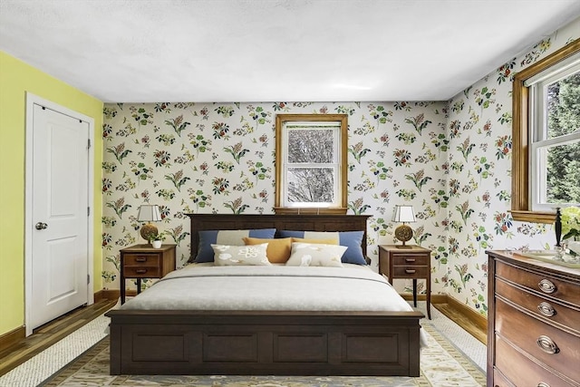 35 Wallace Rd, Wayland, MA 01778 - bedroom featuring baseboards, wood finished floors, and wallpapered walls