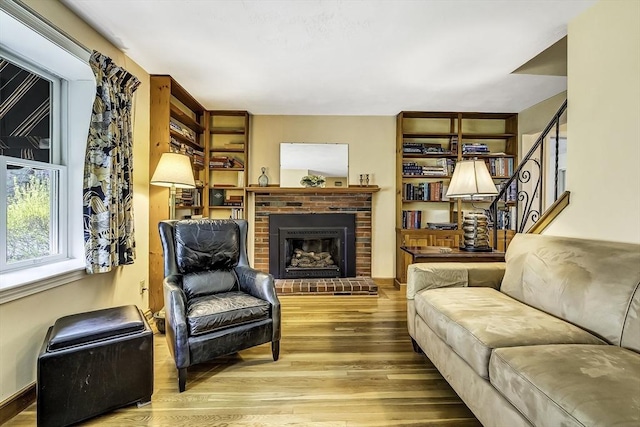 35 Wallace Rd, Wayland, MA 01778 - living area with wood finished floors, a fireplace, and stairway