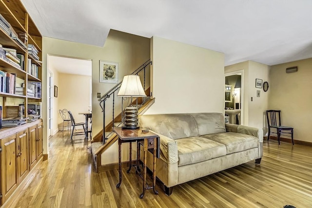 35 Wallace Rd, Wayland, MA 01778 - sitting room featuring stairs, baseboards, and light wood-style flooring