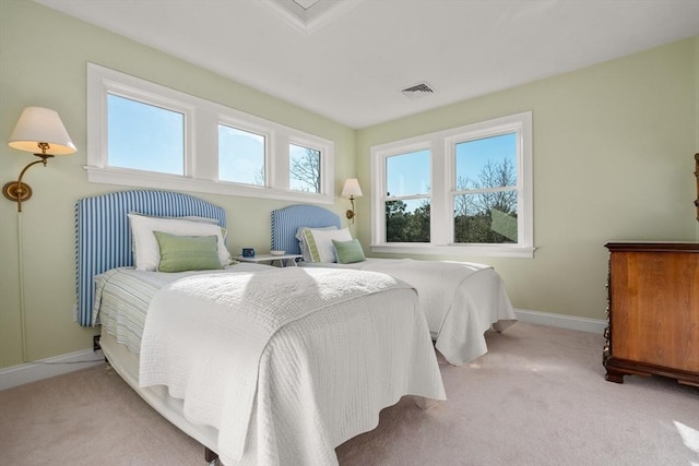 bedroom featuring light carpet