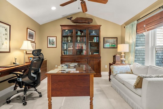 carpeted office space with vaulted ceiling with beams and ceiling fan